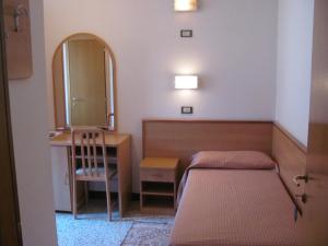 Postel nebo postele na pokoji v ubytování Albergo Moretti