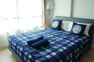 Ένα ή περισσότερα κρεβάτια σε δωμάτιο στο Baan Peang Ploen Huahin By Mayya