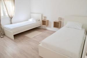 Postel nebo postele na pokoji v ubytování Ivano & Franko apartments