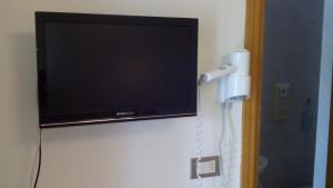 TV a/nebo společenská místnost v ubytování Albergo Moretti