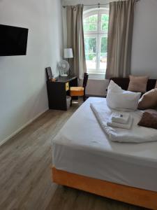 Postel nebo postele na pokoji v ubytování Perle Hotel + 5 fotografií
