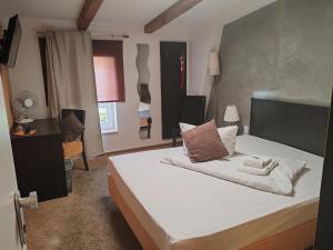 Postel nebo postele na pokoji v ubytování Perle Hotel