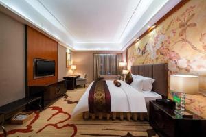 TV a/nebo společenská místnost v ubytování Yihao International Hotel