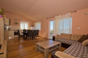 a living room with a couch and a table at Apartmani Vini in Hvar
