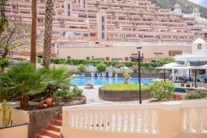 a view of the hotel from the balcony of a resort at Castle Harbour with heated pool ap Patricia in Los Cristianos