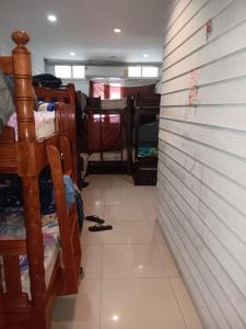 a room with a wall and a tiled floor at New Masala Indian restaurant in Bangkok