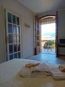 Postel nebo postele na pokoji v ubytování B&B Aria Di Lago