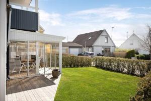 a house with a patio and a yard with grass at large Villa In Central Motala in Motala