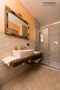 a bathroom with a sink and a shower at B&B Renal&ugrave; in Verbania