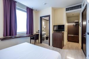 TV a/nebo společenská místnost v ubytování Stadio Hotel