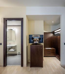 Kuchyň nebo kuchyňský kout v ubytování Stadio Hotel