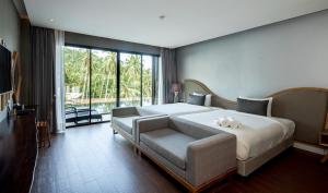 Voodi või voodid majutusasutuse The Tarna Resort, Koh Tao toas