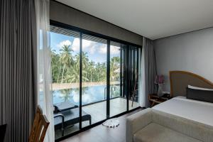 Voodi või voodid majutusasutuse The Tarna Resort, Koh Tao toas