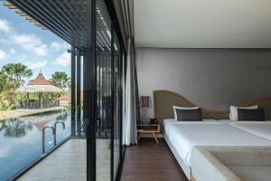 Voodi või voodid majutusasutuse The Tarna Resort, Koh Tao toas