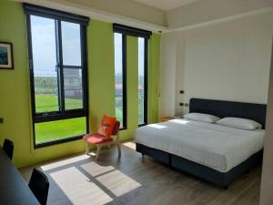 Rúm í herbergi á Chao Zhou 86 B&B