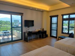 Rúm í herbergi á Chao Zhou 86 B&B