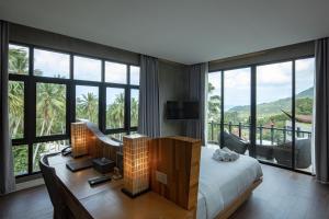 Voodi või voodid majutusasutuse The Tarna Resort, Koh Tao toas