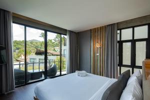Voodi või voodid majutusasutuse The Tarna Resort, Koh Tao toas