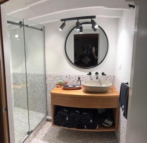 a bathroom with a sink and a mirror at Outback Cellar & Country Cottage in Dubbo +24 photos