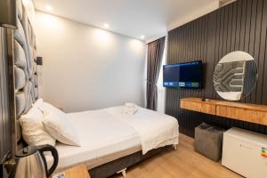 Postel nebo postele na pokoji v ubytování Highway 34 Hotel