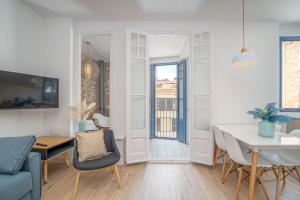 a living room with a table and a dining room at Milenial Immo ADC2-1 Apartment 200m Dali Museum in Figueres