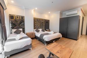 Postel nebo postele na pokoji v ubytování Highway 34 Hotel