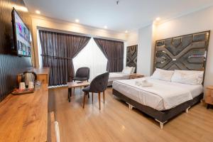 Postel nebo postele na pokoji v ubytování Highway 34 Hotel