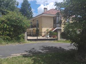 a house with a fence in front of it at Les Lauriers in Combas