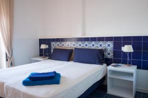 Postel nebo postele na pokoji v ubytování Residenza Punta Stendardo