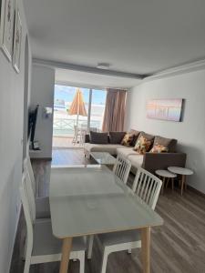 a living room with a couch and a table and chairs at Omayra Beach in Tías
