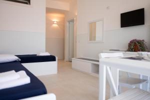 TV a/nebo společenská místnost v ubytování Residenza Punta Stendardo