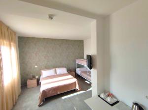 Postel nebo postele na pokoji v ubytování Hotel Bastione
