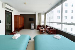 Rúm í herbergi á Onestar Danang Riverside