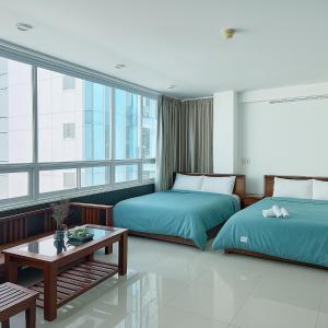 Rúm í herbergi á Onestar Danang Riverside