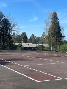 a tennis court with a net on it at No6 Risør in Risør