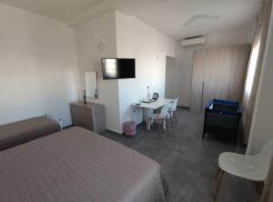 TV a/nebo společenská místnost v ubytování Hotel Bastione
