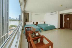 Rúm í herbergi á Onestar Danang Riverside