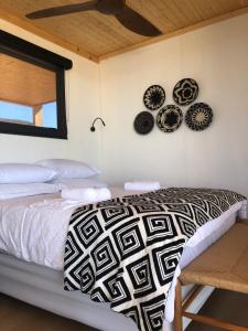 Ένα ή περισσότερα κρεβάτια σε δωμάτιο στο Bokmakierie Cabin, Tankwa Karoo
