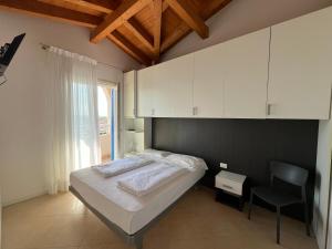 Posteľ alebo postele v izbe v ubytovaní Villaggio Hemingway - Family Aparthotel
