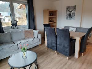 a living room with a couch and a table at Landhaus Seppi in Lake Pressegg