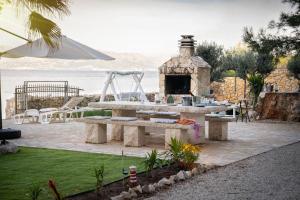 a park with a picnic table and a playground at Beach Garden Brač in Mirce
