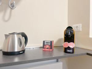 a kitchen counter with a toaster and a bottle of wine at Designer Suite - Luxury - Via Sestri - Free WiFi in Genova
