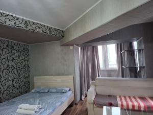 Postel nebo postele na pokoji v ubytování Apartment in street Kievskaya 49
