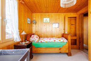 Ένα ή περισσότερα κρεβάτια σε δωμάτιο στο Sunny Mountain