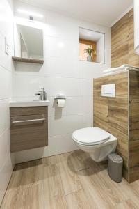 a bathroom with a toilet and a sink at Polár in Makó +51 photos