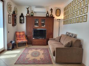 Posezení v ubytování Casa Intignano - appartamento con terrazzo vista lago