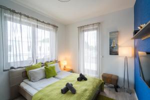 Posteľ alebo postele v izbe v ubytovaní Fox apartman A11