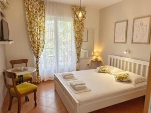 Postel nebo postele na pokoji v ubytování LAV Apartments