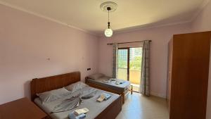 Voodi või voodid majutusasutuse Illyrian Hotel toas