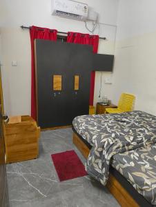 Ένα ή περισσότερα κρεβάτια σε δωμάτιο στο Anantham Home Stay
